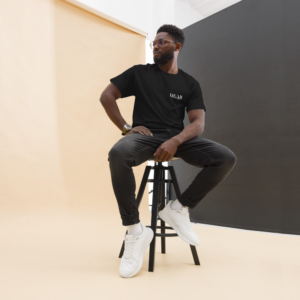 Unisex black T-Shirt with the message "Dear Stranger, one small act of kindness can make a big difference. Be the reason someone feels seen today!"