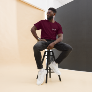 Unisex Maroon T-Shirt with the message "Dear Stranger, one small act of kindness can make a big difference. Be the reason someone feels seen today!"